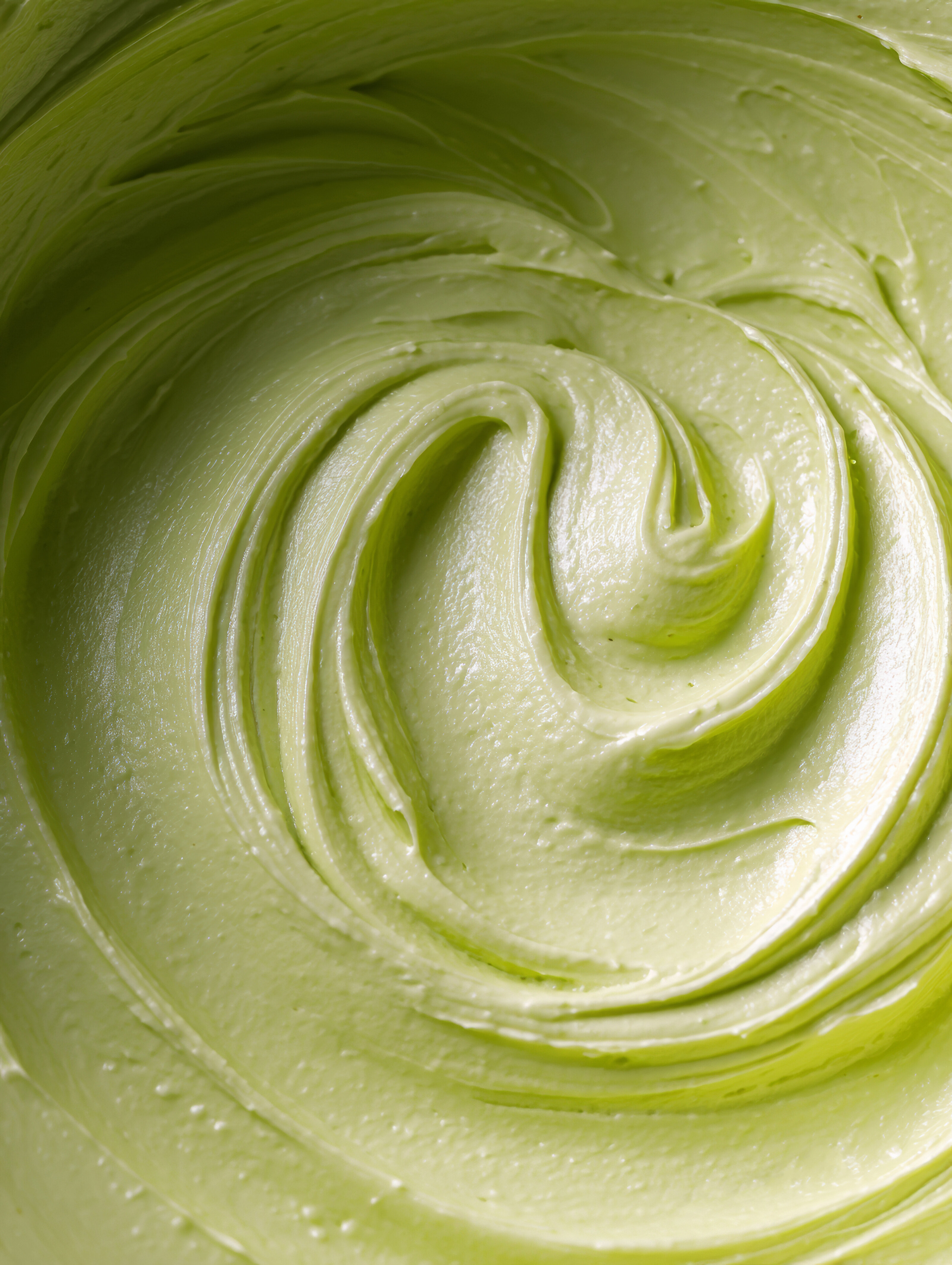 laurenredman_A_close-up_of_the_top_view_of_a_green_avocado_mo_67e911a2-2872-472e-a05a-9fd41ed6fb87_0