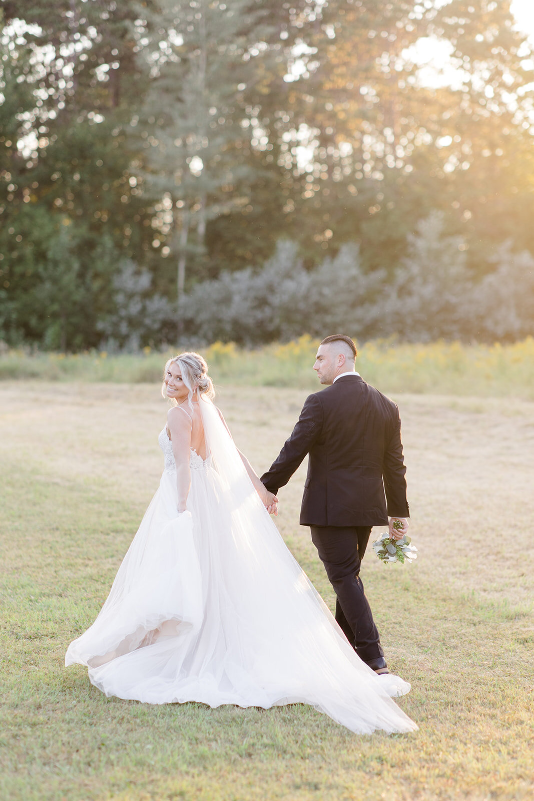 Couple walking away from the camera after their wedding ceremony