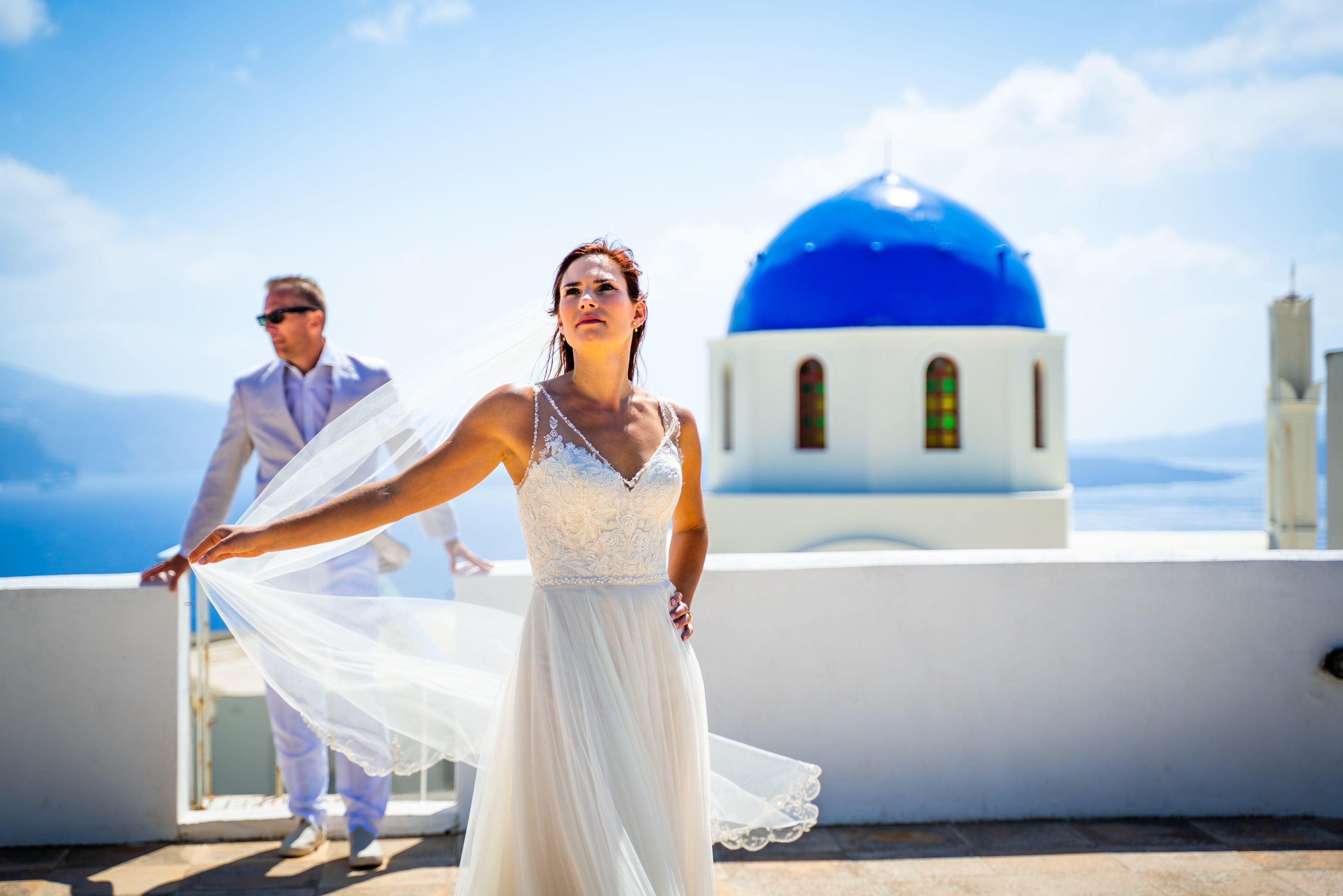 wedding couple standing on rooftop in santorini greece Photographers in Texas