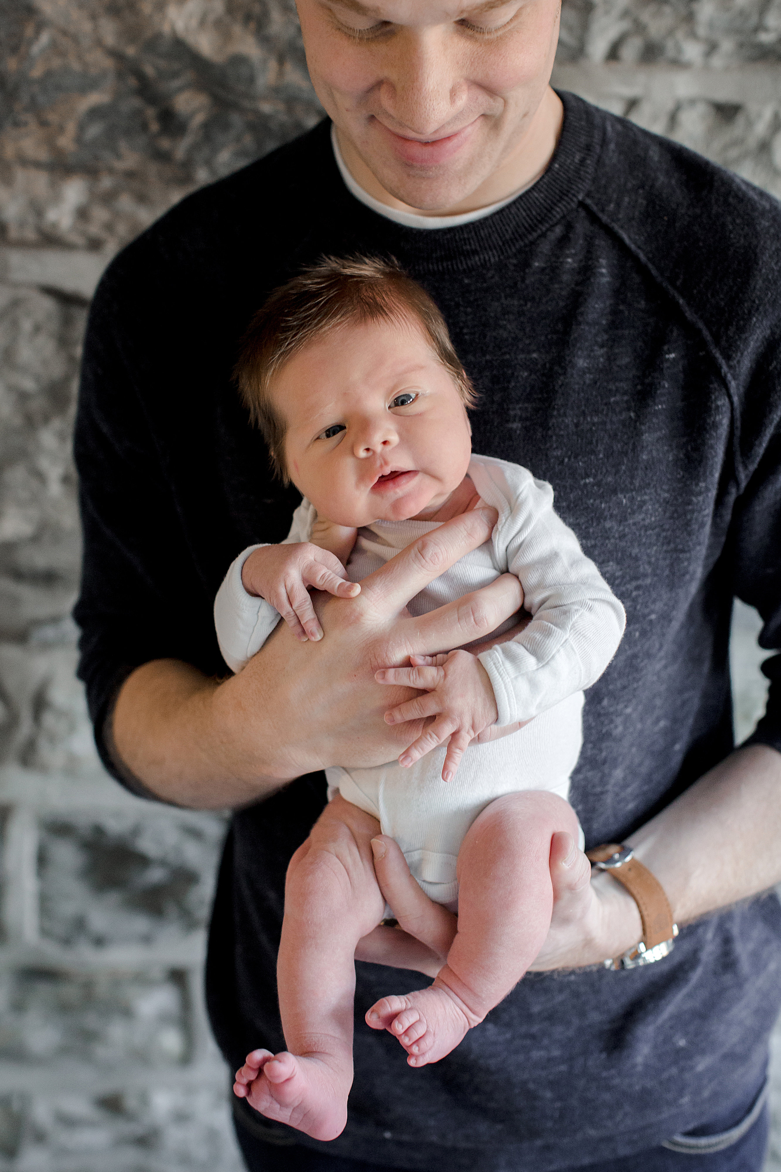 Dad holding his new baby boy | Nicola Herring Newborn Photography