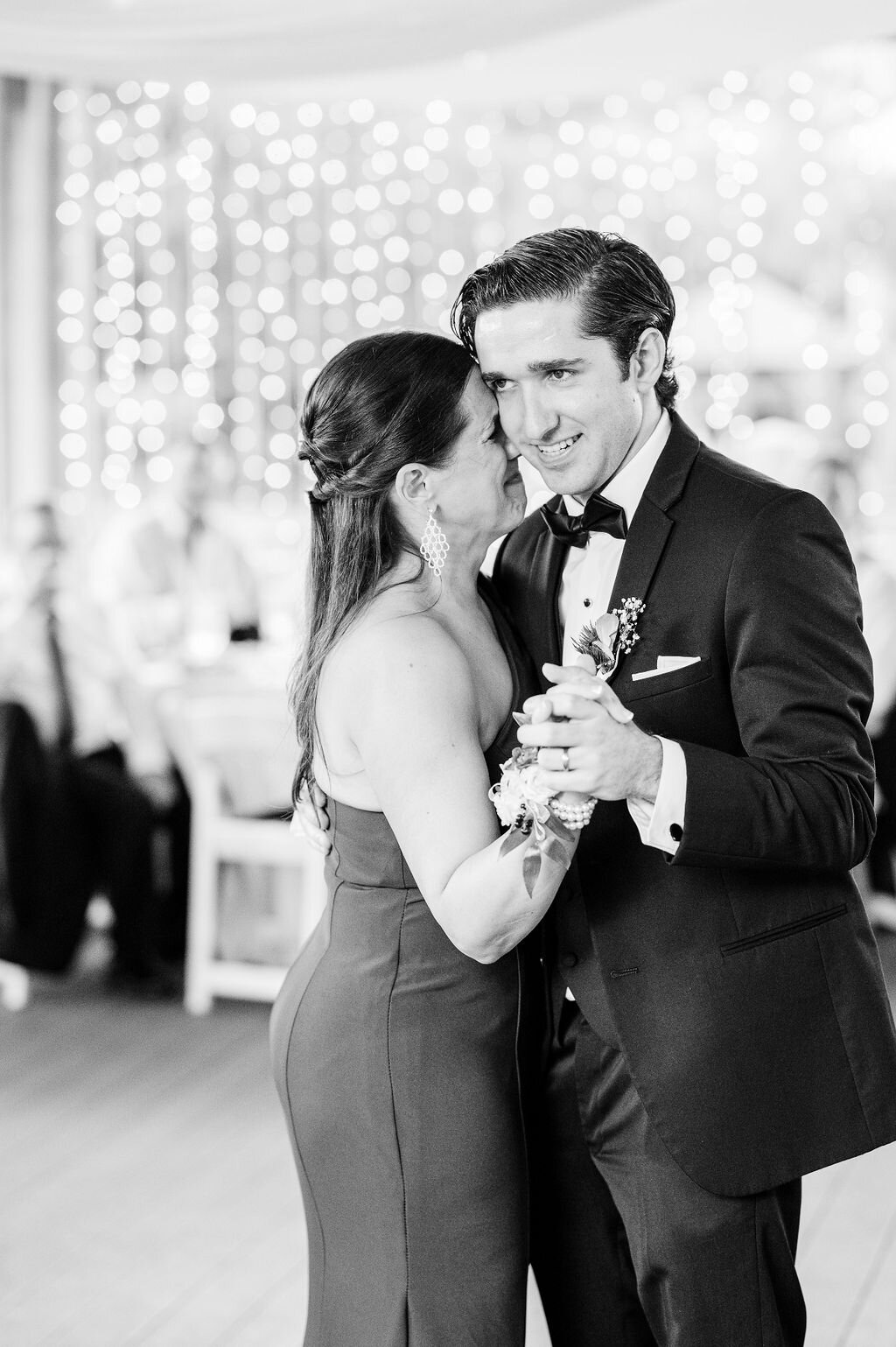 A touching moment between a groom and his mother during their first dance at a Savannah, Georgia wedding. Captured by Amia Marcell Photography, this emotional and elegant black-and-white image reflects the timeless beauty of wedding celebrations. As one of the best wedding photographers in Savannah, we specialize in capturing genuine emotions and unforgettable moments.