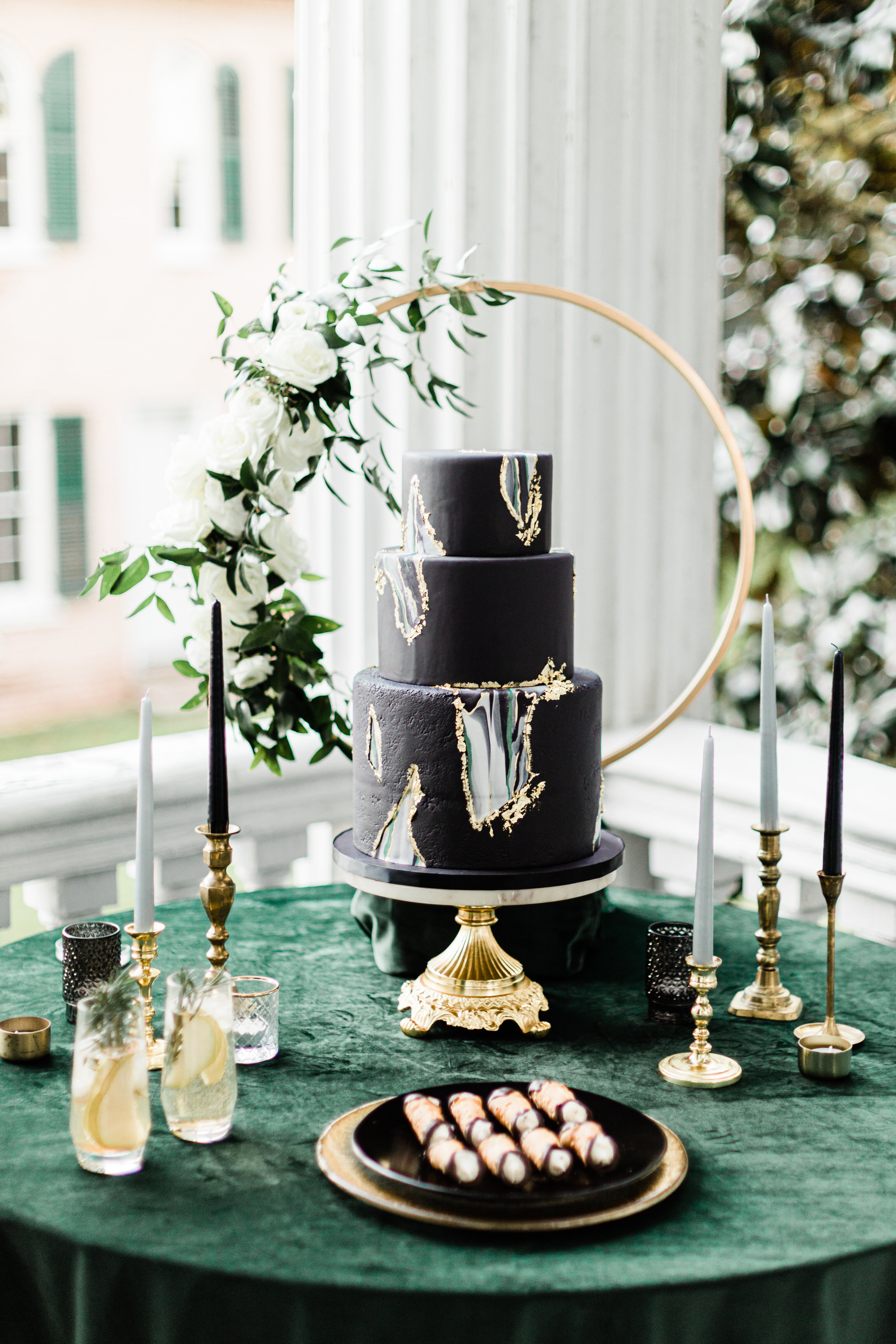 Beautiful black wedding cake and table setup