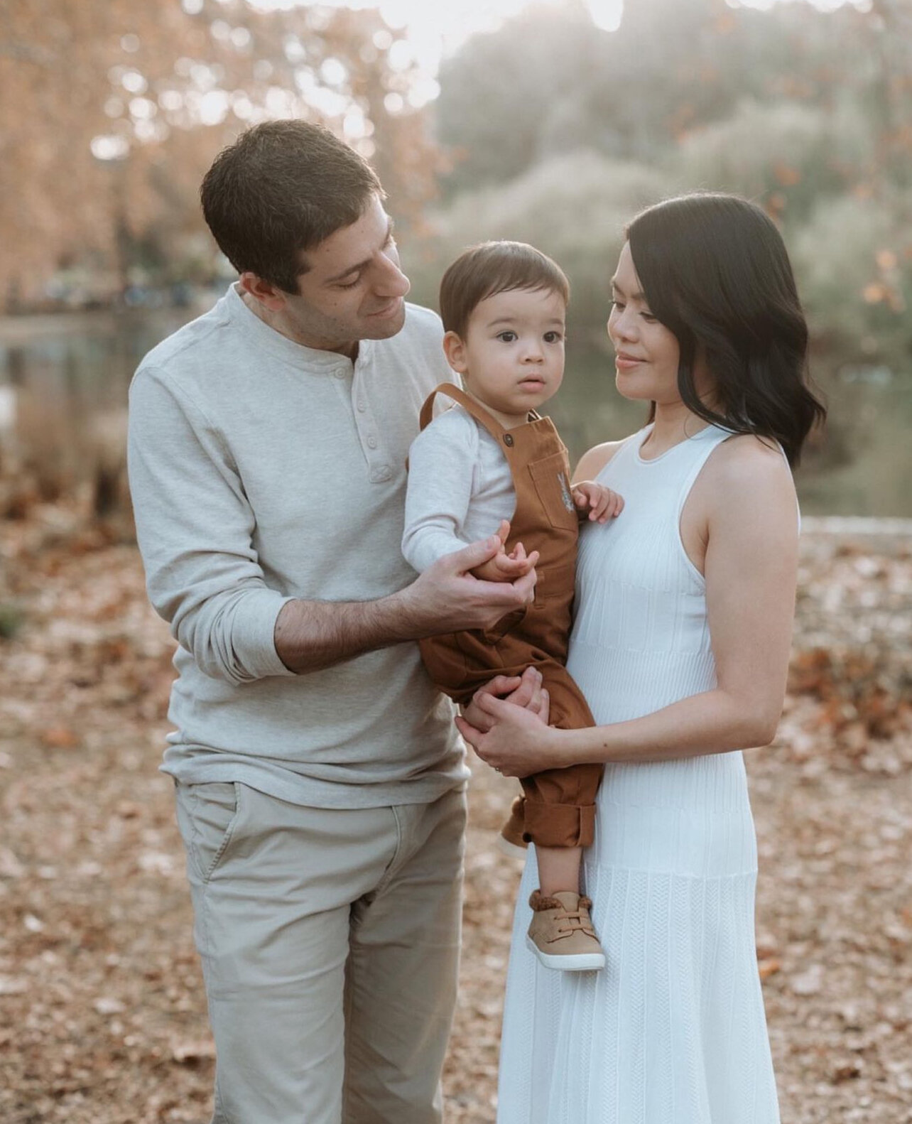 Tender moment between parents and their child during a Perth family session
