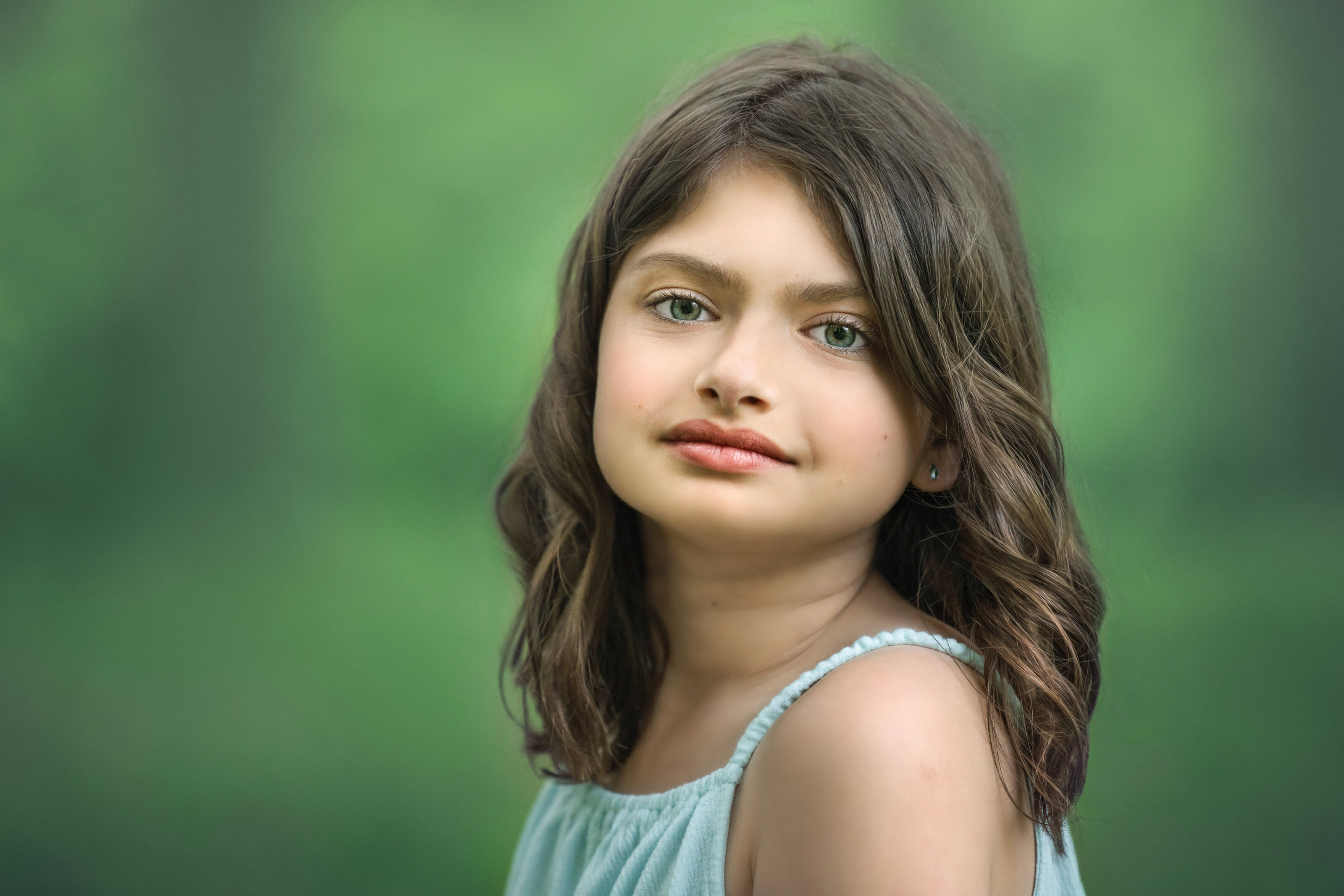 child looks at camera for fine art portrait during family photograph session at NJ park