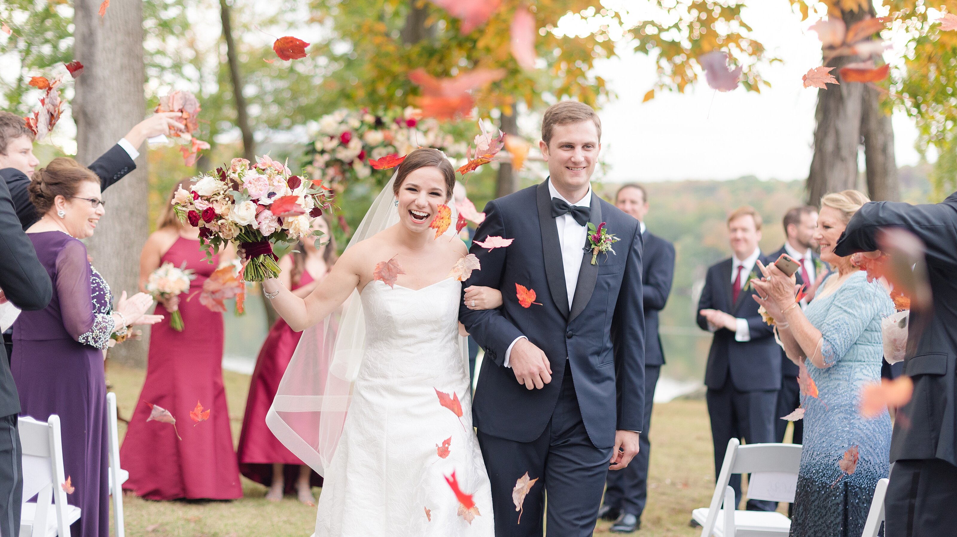 9_Leaves-are-thrown-as-the-bride-and-groom-exit-a fall-ceremony