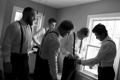 Groom getting ready with groomsmen photos at Daras Garden Wedding Venue in Knoxville, Tennessee.