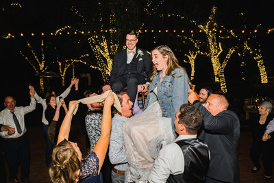 The newlyweds enjoying their wedding reception captured by Tony George Photography