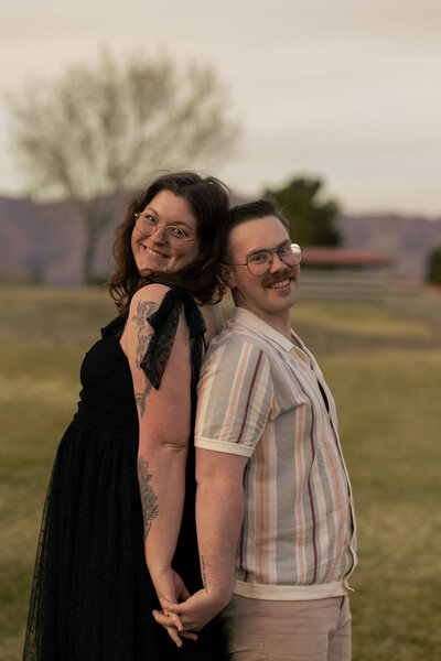 dad holding toddler in the air during their portrait session with alexis dean photography near Las Vegas