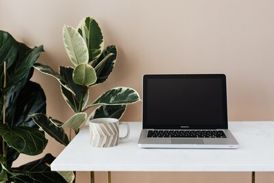 computer and mug on desk