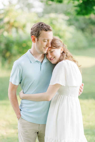 engaged couple hugging