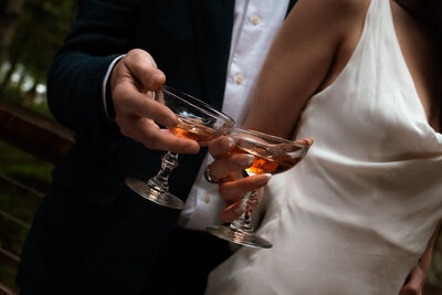 Bride and groom drinking wine at their estate wedding in Portland Oregon