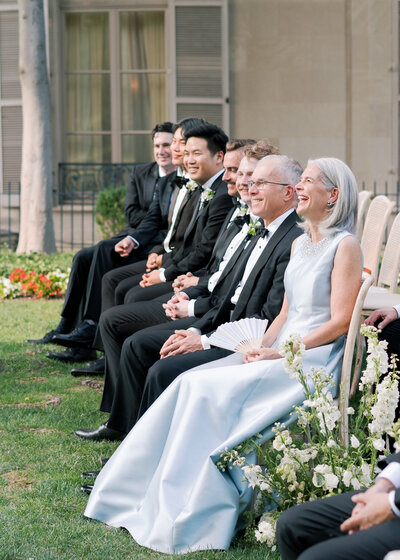 Newlywed couple in wedding dress and tux walking hand in hand at the US Supreme Court