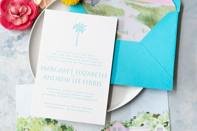 Formal invitation featuring letterpress technique, turquoise ink, and line-drawn palm tree, designed for a Charleston wedding