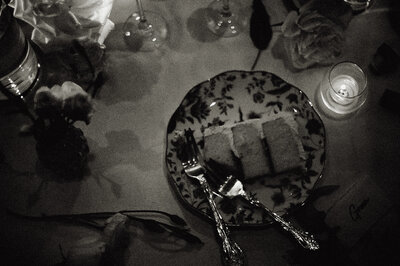BW Cake piece with two forks at bridal table