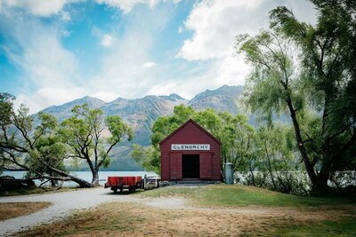 The red Glenorchy shed situated at the Glenorchy lake front on the shores of Lake Wakatipu.