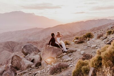 bride and groom at keys view during sunset in joshua tree