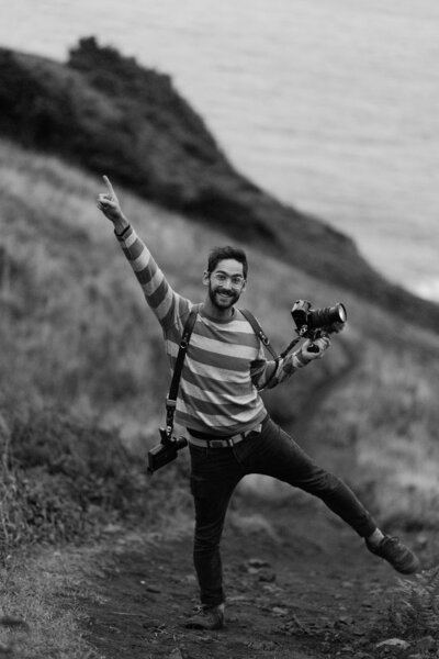 Ben standing on cliffs along Oregon coast