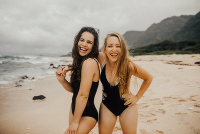 girls posing and smiling at the beach