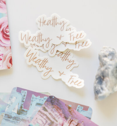 wealthy and free stickers on desk
