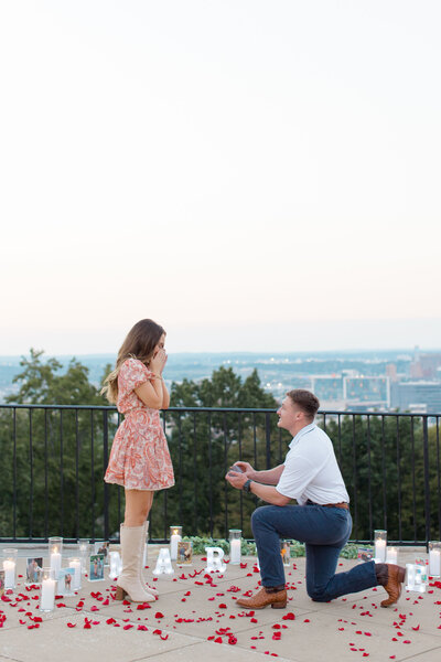 Man proposing to surprised girlfriend