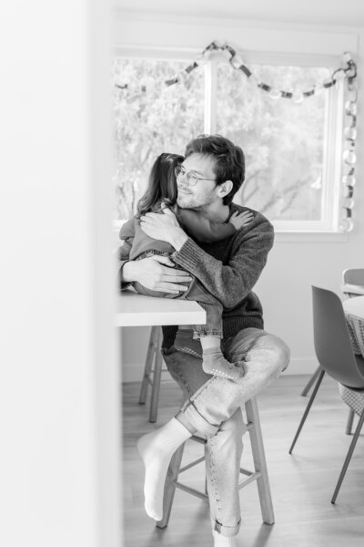 Dad and Daughter at home hugging