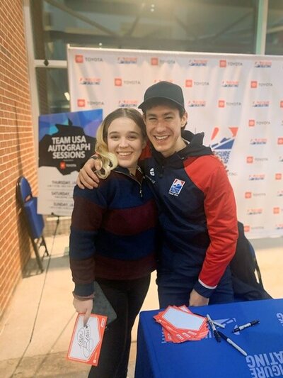 girl smiling with USA National figure skater Jason Brown
