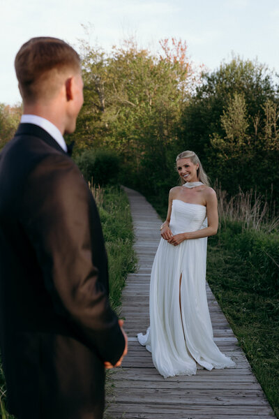 VT Wedding Photographer | Sincerely Liz Photography Documentary Wedding, Engagement, Elopement, Maternity and Newborn Photographer in New England | Groom looking at bride ash she walks
