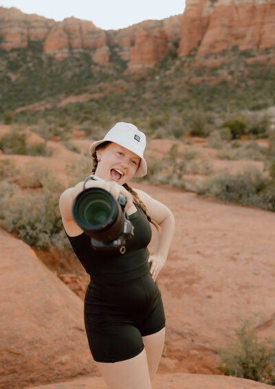 photo of wedding photographer in missouri posing with her camera