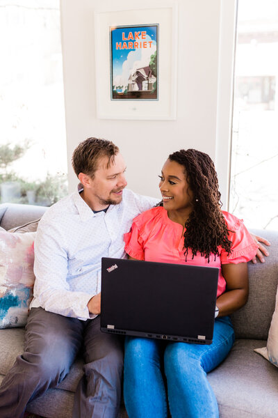 man and woman working on laptop together