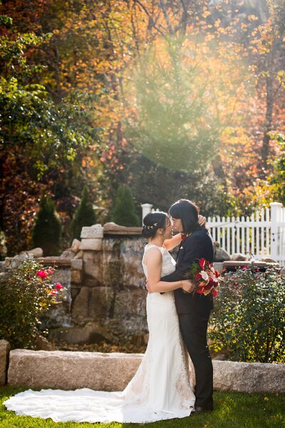 Couple facing each other, holding each other in arms