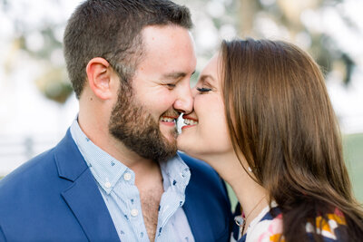 Close up of a man and woman near kissing in their engagement portrait by Tampa photographer, Tina Marie.