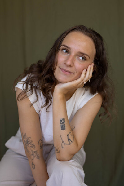 A woman drinks coffee