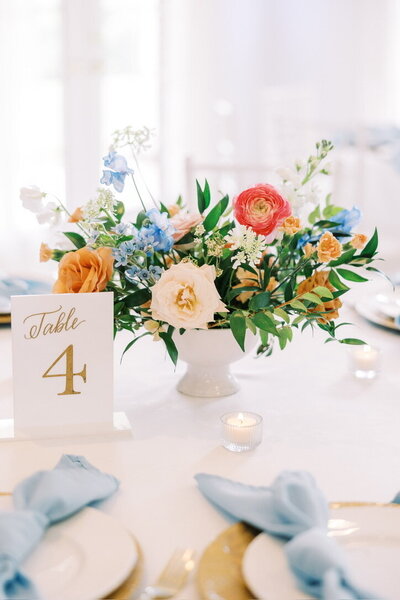 Romantic colorful flowers decorate a table at a Texas wedding.