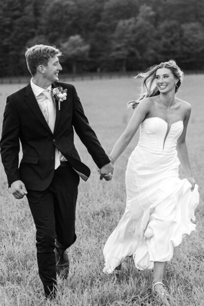 Photo of bride and groom running