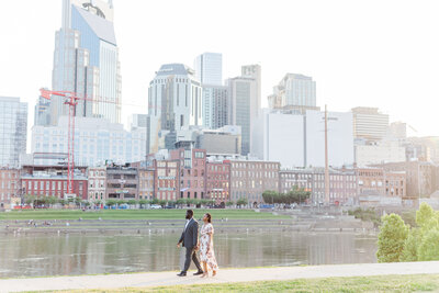 photo of engaged couple walking along the Nashville Tennessee Riverfront