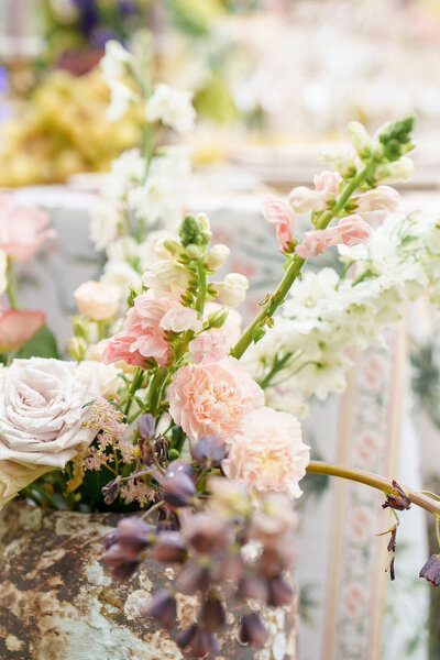 flowers sitting on wedding reception table