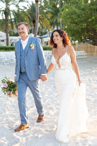 Bride and groom running on Ritz carlton tiburon golf course