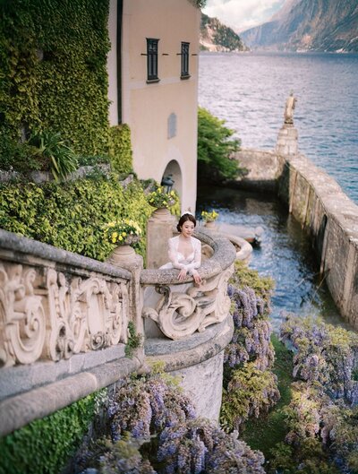 Bridal portrait in wisteria during a villa del Balbianello wedding, by luxury destination wedding photographer Andreas K. Georgiou  