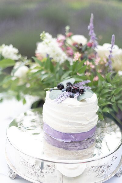 small cake with berries and florals