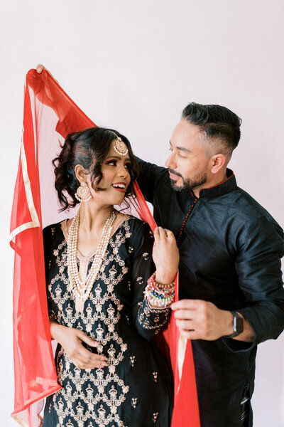 Dallas elopement bride and groom pose in downtown arts district