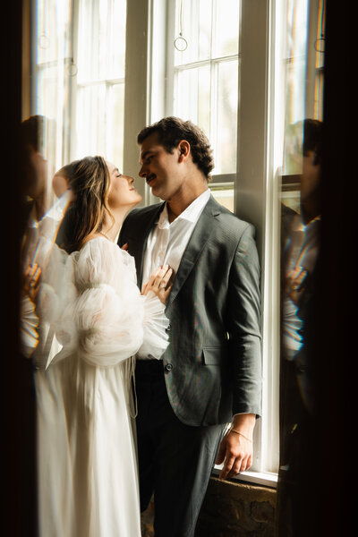 A quiet, emotional moment shared between the bride and groom on their wedding day in Kentucky, filled with love and tenderness.