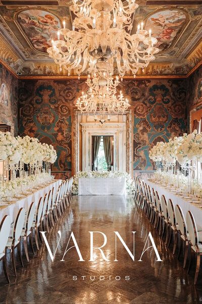 Sophisticated logo design over a destination wedding event image for a luxury photographer.