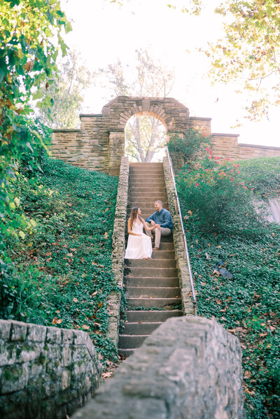 Couple sitting on stone stairs