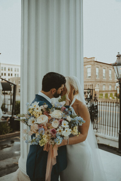 man embracing woman from behind