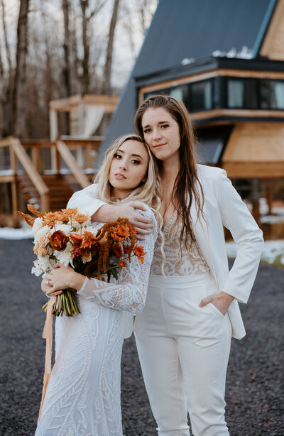 A frame elopement in the Finger Lakes region of New York showing a couple at an a frame cabin. Upstate New York elopement