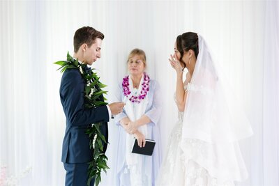 A person reading their vows to their partner during their wedding ceremony 