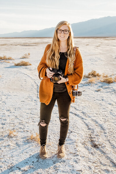 Santa Barbara elopement photographer holding camera gear