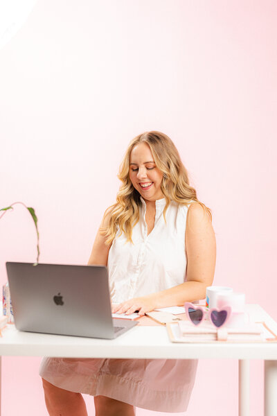 Amy Hart the Dubsado specialist working at her desk