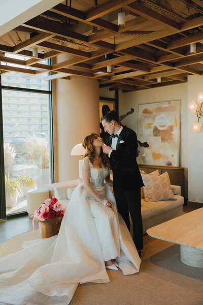couple poses in the wave resort for their wedding