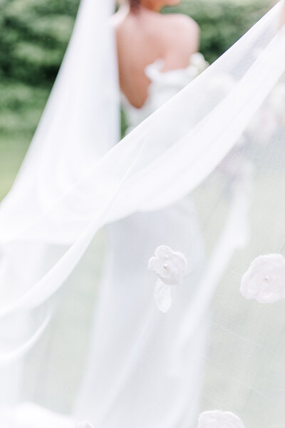 veil flying in the wind on the beach
